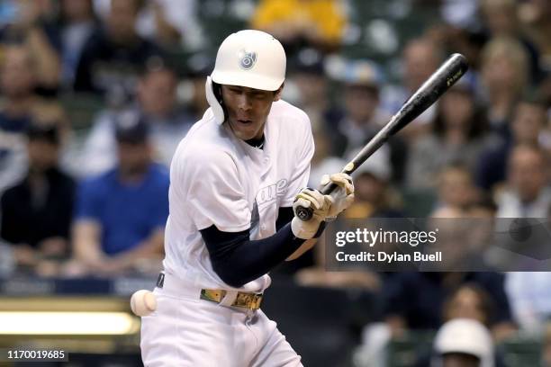 Christian Yelich of the Milwaukee Brewers is hit by a pitch in the seventh inning against the Arizona Diamondbacks at Miller Park on August 24, 2019...