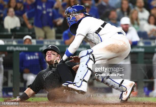 Danny Jansen of the Toronto Blue Jays forces out Daniel Vogelbach of the Seattle Mariners at home in the eighth inning during their game at T-Mobile...