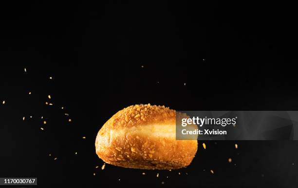 fried bread dancing in mid air captured with high speed sync. - bounce back stock-fotos und bilder