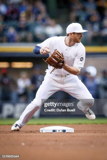 Cory Spangenberg of the Milwaukee Brewers attempts to turn a double play in the first inning against the Arizona Diamondbacks at Miller Park on...