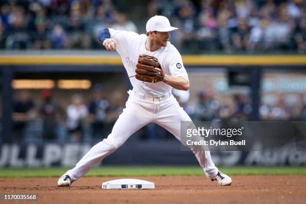 Cory Spangenberg of the Milwaukee Brewers attempts to turn a double play in the first inning against the Arizona Diamondbacks at Miller Park on...