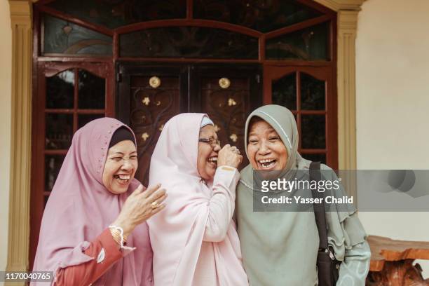 senior muslim woman - malay hijab stock-fotos und bilder