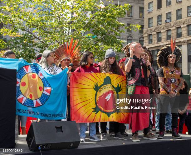 Indigenous people from Brazil and Puerto Rico on stage during NYC Climate Strike rally and demonstration at Foley Square.