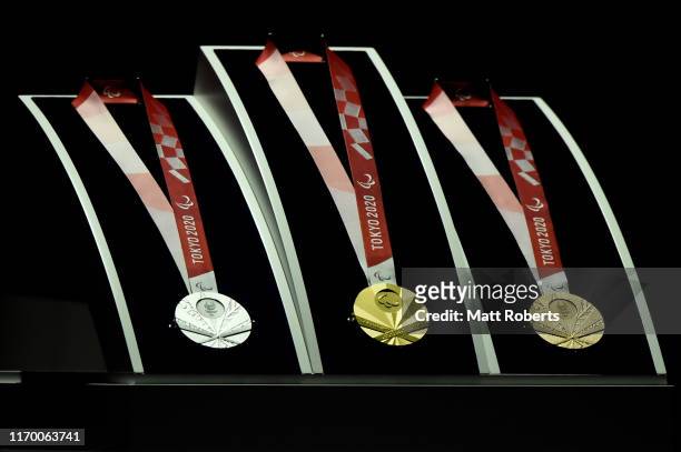 The silver, gold and bronze medals are displayed on stage during the Count Down Ceremony of the Tokyo 2020 Paralympic Games One Year To Go at the NHK...