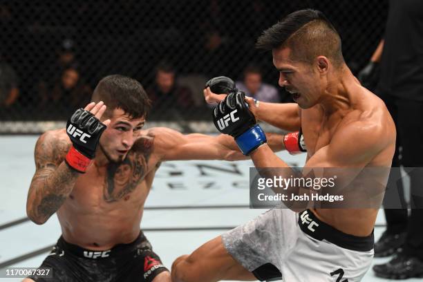 Steven Peterson punches Tyson Nam in their flyweight bout during the UFC Fight Night event on September 21, 2019 in Mexico City, Mexico.
