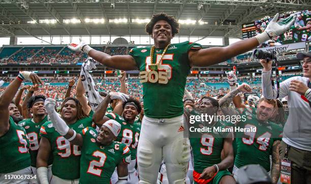 Miami defensive lineman Gregory Rousseau wears the turnover chain for the first time in his career when he recovered a fumble that he caused in the...