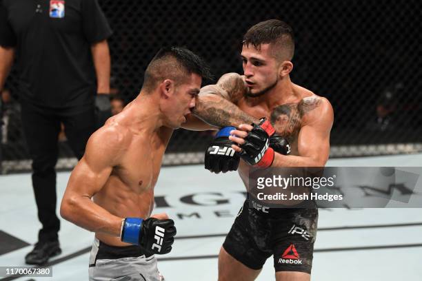 Sergio Pettis elbows Tyson Nam in their flyweight bout during the UFC Fight Night event on September 21, 2019 in Mexico City, Mexico.