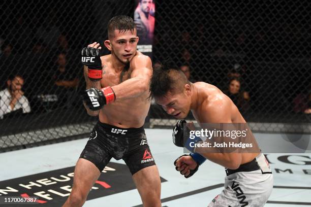 Sergio Pettis punches Tyson Nam in their flyweight bout during the UFC Fight Night event on September 21, 2019 in Mexico City, Mexico.