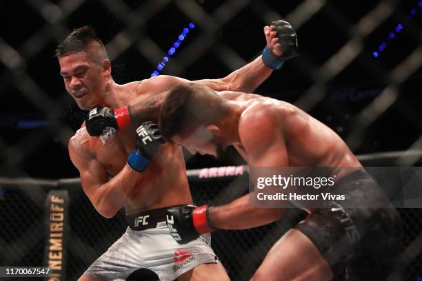 Sergio Pettis punches Tyson Nam in their flyweight bout during UFC Fight Night event at Arena Ciudad de Mexico on September 21, 2019 in Mexico City,...