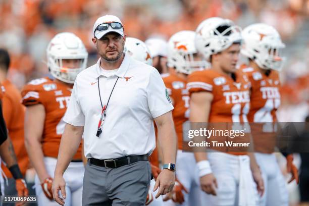Head coach Tom Herman of the Texas Longhorns watches players warm up before the game against the Oklahoma State Cowboys at Darrell K Royal-Texas...
