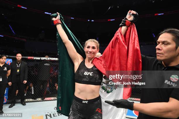Irene Aldana of Mexico celebrates her victory over Vanessa Melo of Brazil in their women's bantamweight bout during the UFC Fight Night event on...