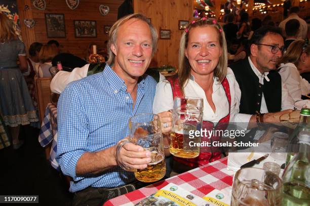 Gerhard Delling and his partner Vicki Hinrichs during the Oktoberfest 2019 opening at Theresienwiese on September 21, 2019 in Munich, Germany.