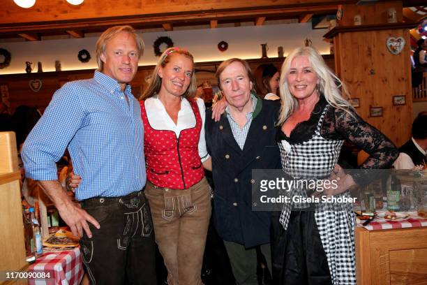 Gerhard Delling and his partner Vicki Hinrichs, Guenter Netzer and his wife Elvira Lang Netzer during the Oktoberfest 2019 opening at Theresienwiese...
