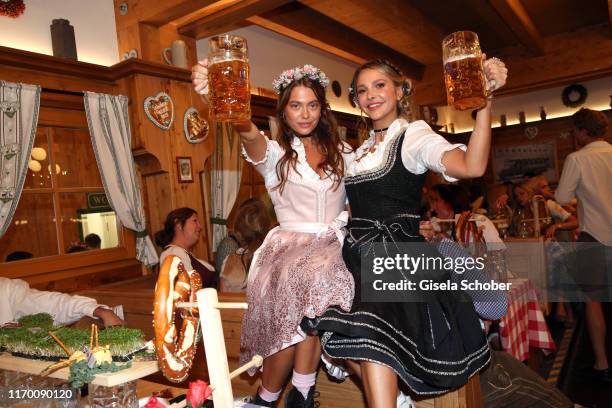 Heloise Agostinelli and Sophie Hermann during the Oktoberfest 2019 opening at Theresienwiese on September 21, 2019 in Munich, Germany.