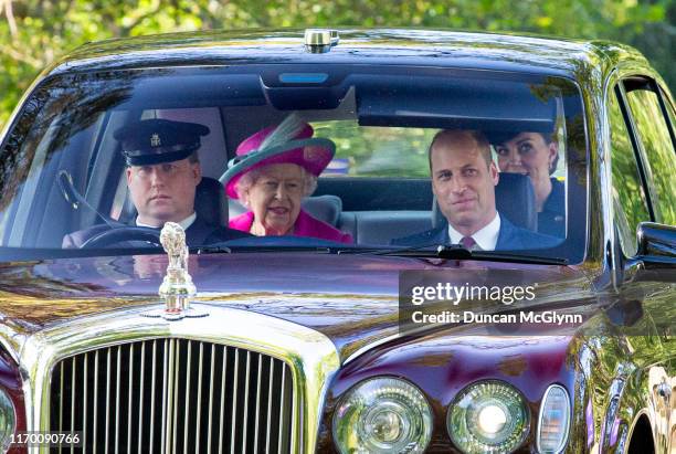 Queen Elizabeth II, Prince William, Duke of Cambridge and Catherine, Duchess of Cambridge drive to Crathie Kirk Church before the service on August...