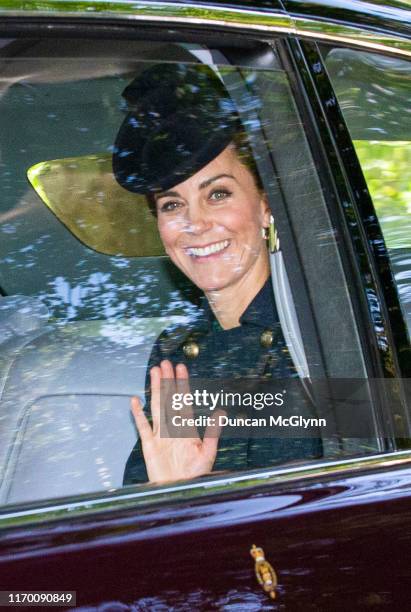 Catherine, Duchess of Cambridge waves while she is driven to Crathie Kirk Church before the service on August 25, 2019 in Crathie, Aberdeenshire....