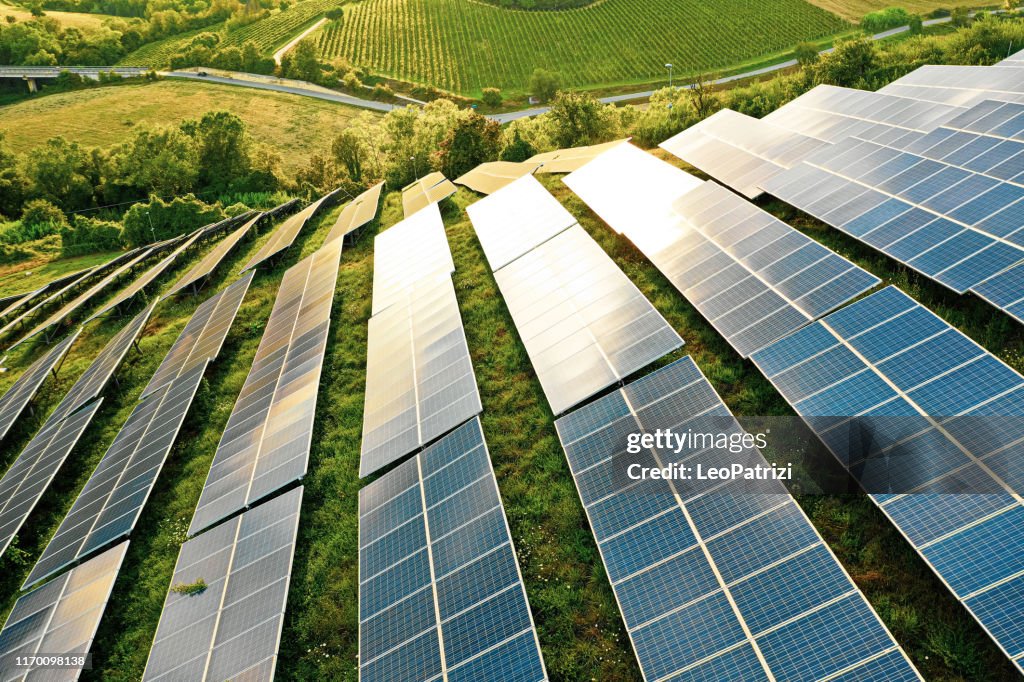 Solar panels fields on the green hills
