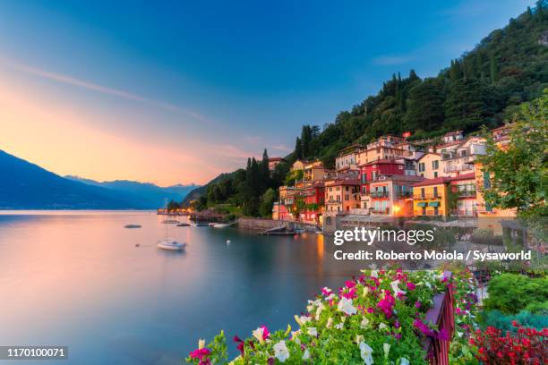 sunset over varenna, lake como, italy - baie eau photos et images de collection