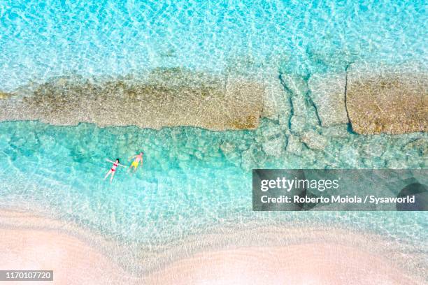 people floating in the caribbean sea, antilles - island of antigua stock pictures, royalty-free photos & images
