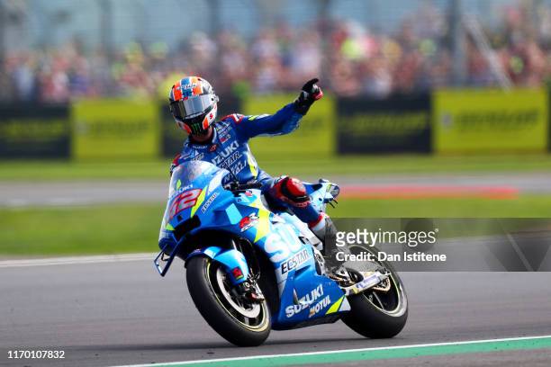 Alex Rins of Spain and Team Suzuki Ecstar celebrates victory after the MotoGP of Great Britain at Silverstone Circuit on August 25, 2019 in...