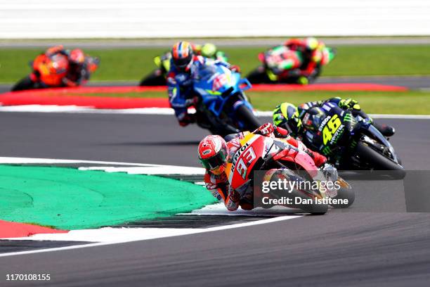 Marc Marquez of Spain and Repsol Honda leads Valentino Rossi of Italy and Monster Energy Yamaha MotoGP and Alex Rins of Spain and Team Suzuki Ecstar...