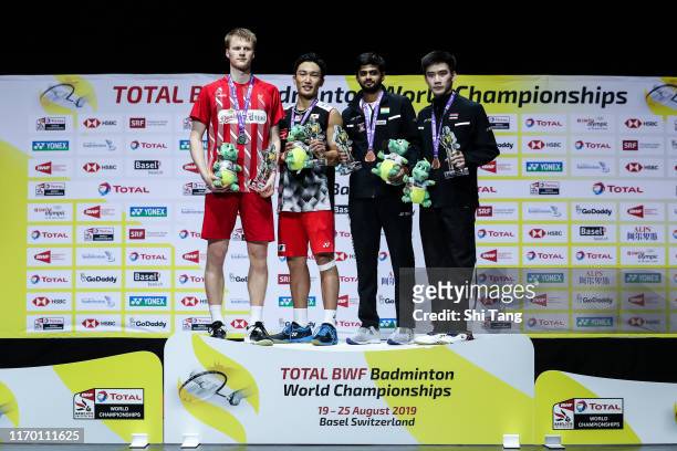 Second placed Anders Antonsen , champion Kento Momota of Japan and third placed Sai Praneeth B. Of India and Kantaphon Wangcharoen of Thailand pose...