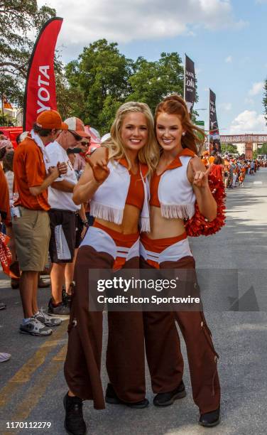 Cheerleaders await the team parade into the stadium before the NCAA football game between Oklahoma State Cowboys and the Texas Longhorns held...