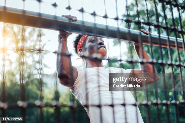 young man doing workout on sports court - mission court grip stock pictures, royalty-free photos & images