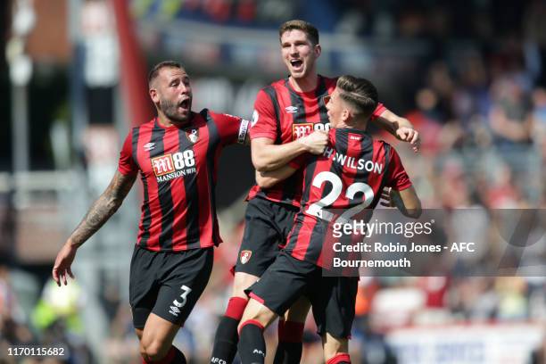 Harry Wilson of Bournemouth is congratulated by team-mates Steve Cook and Chris Mepham after scores a goal to make it 2-1 direct from a free-kick...