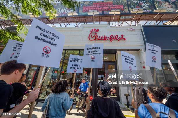 Protesters targeted Chick-Fil-A for their alleged homophobe stance - some of the banners accused Chick-Fil-A of being anti gay. Members of the...