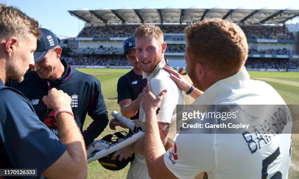 Ben Stokes of England celebrates with teammate Jonathan Bairstow after hitting the winning runs to win the 3rd Specsavers Ashes Test match between...