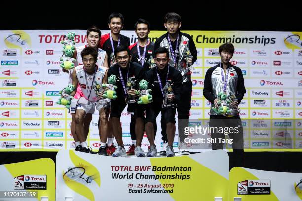 Second placed Takuro Hoki and Yugo Kobayashi of Japan, champion Hendra Setiawan and Mohammad Ahsan of Indonesia and third placed Fajar Alfian and...