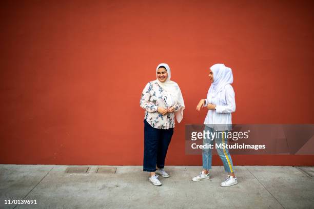 two muslim friends. - chubby arab stock pictures, royalty-free photos & images
