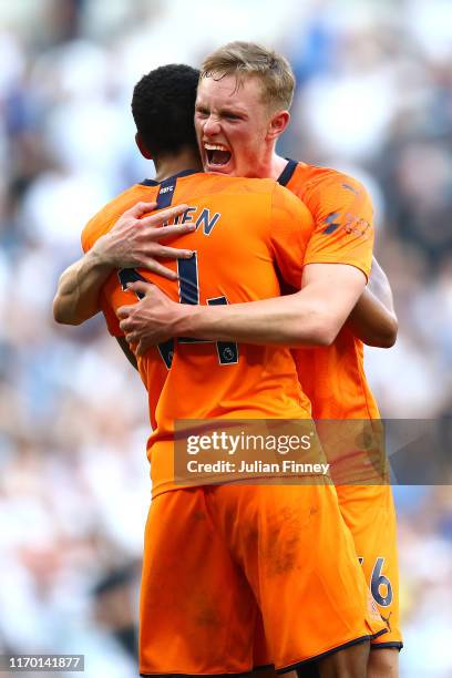 Sean Longstaff of Newcastle United hugs Isaac Hayden of Newcastle United after their sides victory in the Premier League match between Tottenham...