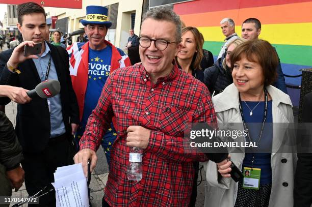 Main opposition Labour party deputy leader Tom Watson gestures as he walks during the Labour party conference in Brighton, on the south coast of...