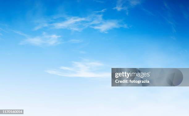 clear blue sky background - sparse clouds stock pictures, royalty-free photos & images