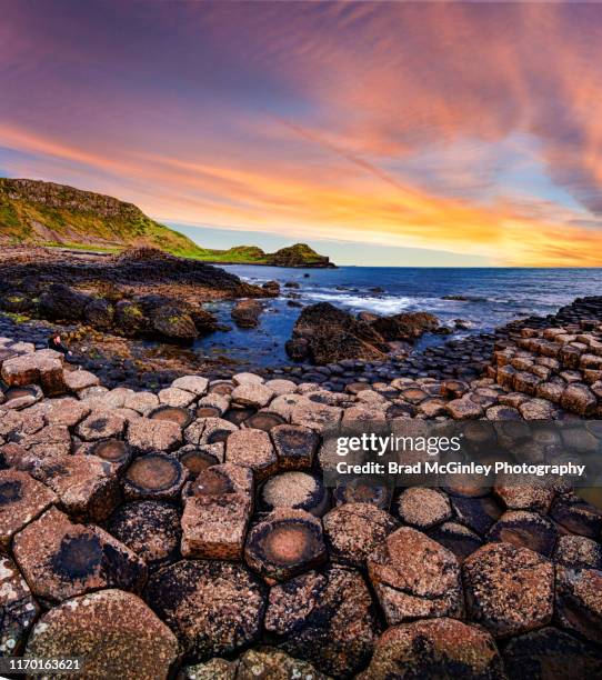 sunset over giant's causeway - giant's causeway stock pictures, royalty-free photos & images