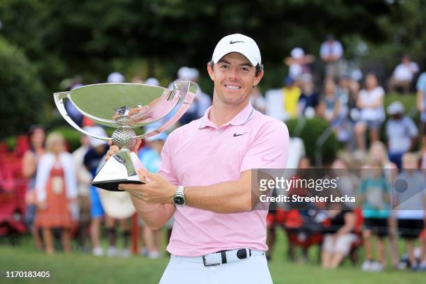 Rory McIlroy of Northern Ireland celebrates with the FedExCup trophy after winning during the final round of the TOUR Championship at East Lake Golf...
