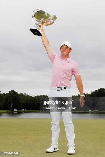 Rory McIlroy of Northern Ireland celebrates with the FedExCup trophy after winning during the final round of the TOUR Championship at East Lake Golf...