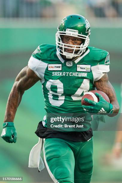 Emmanuel Arceneaux of the Saskatchewan Roughriders runs after a catch in the game between the Ottawa RedBlacks and Saskatchewan Roughriders at Mosaic...