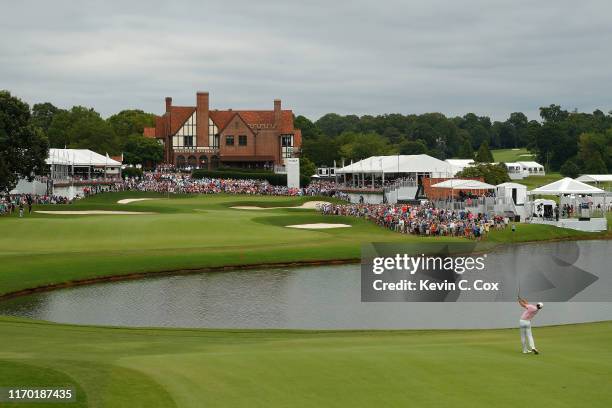 Rory McIlroy of Northern Ireland plays a shot on the 18th hole during the final round of the TOUR Championship at East Lake Golf Club on August 25,...