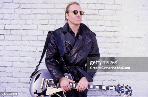 Peter Frampton poses for a portrait holding his guitar in 1992 in New York City, New York.