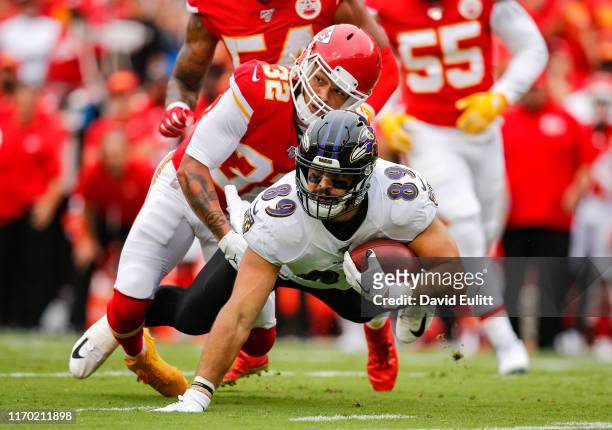 Tyrann Mathieu of the Kansas City Chiefs tackles Mark Andrews of the Baltimore Ravens in the first quarter at Arrowhead Stadium on September 22, 2019...