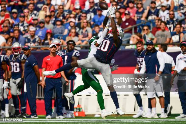 Daryl Roberts of the New York Jets is called for pass interference as he defends Josh Gordon of the New England Patriots during the second quarter of...