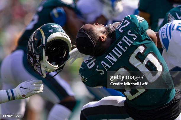 Miles Sanders of the Philadelphia Eagles has his helmet pulled off in the second quarter against the Detroit Lions at Lincoln Financial Field on...