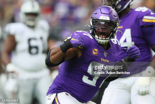 Everson Griffen of the Minnesota Vikings celebrates his sack of Derek Carr of the Oakland Raiders in the second quarter at U.S. Bank Stadium on...
