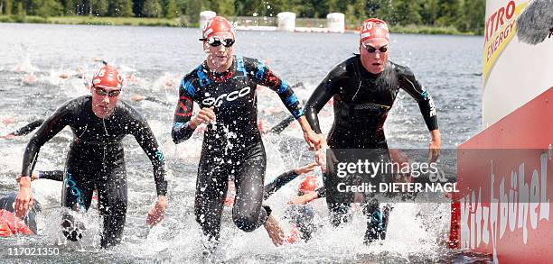 German athlete Svenja Bazlen, Australia´s Emma Moffatt and French Jessica Harrison exit the water during the ITU World Championship Series female...