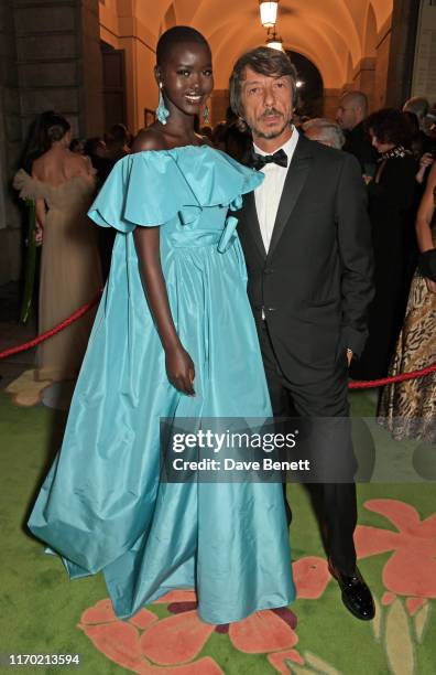 Adut Akech wearing Valentino and Valentino Creative Director Pierpaolo Piccioli attend The Green Carpet Fashion Awards, Italia 2019, hosted by CNMI &...