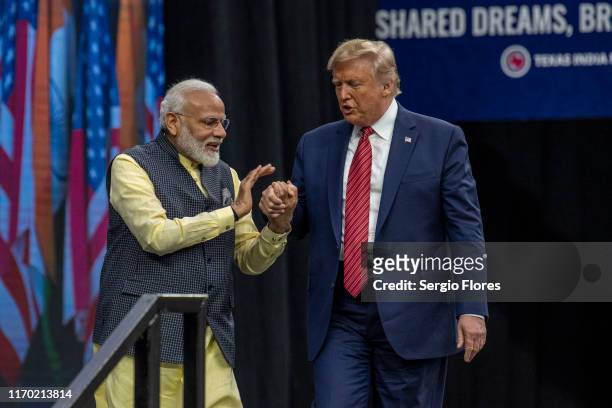 Indian Prime Minster Narendra Modi welcomes U.S. President Donald Trump to the stage at NRG Stadium during a rally on September 22, 2019 in Houston,...