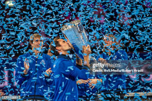 Roger Federer of Team Europe celebrates with the trophy after winning against Team World during Day 3 of the Laver Cup 2019 at Palexpo on September...